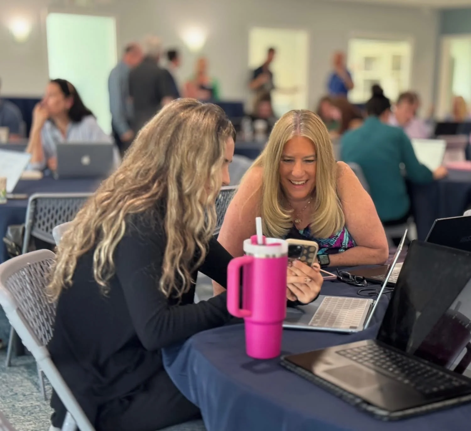 An Ain Hub student helping a business owner one on one